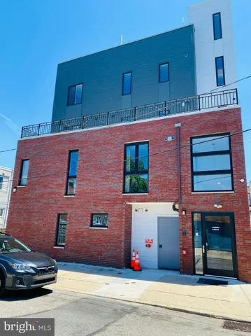 a front view of building with yard