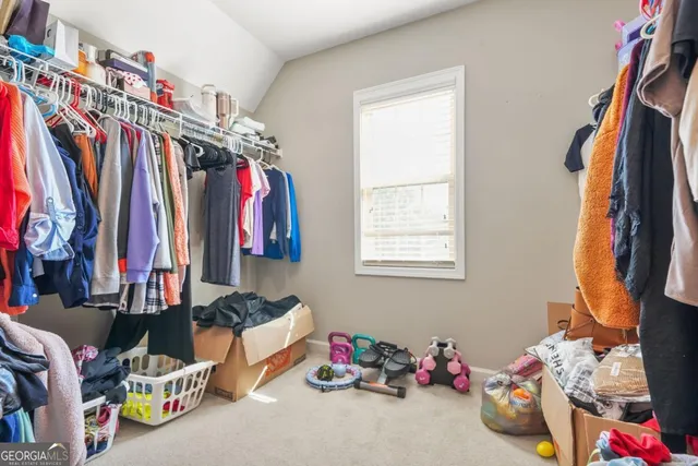 a spacious bathroom with a double vanity sink and a mirror