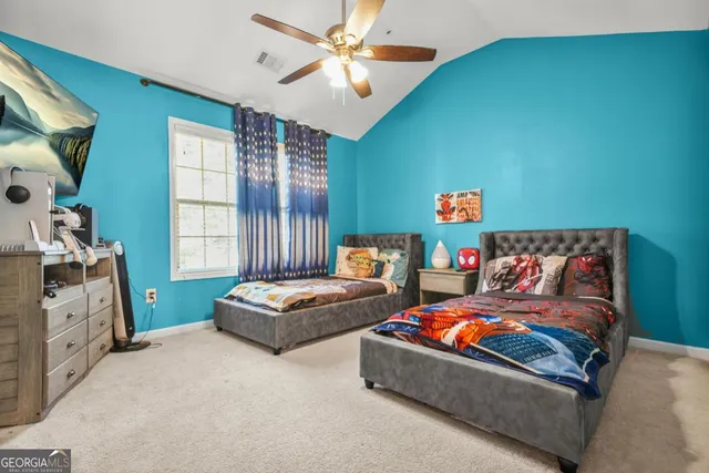 a bedroom with a bed and dresser