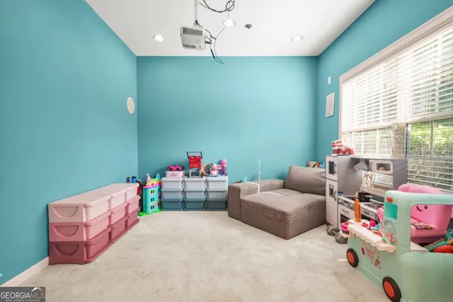 a bedroom with furniture and a window