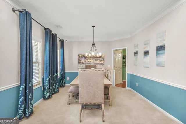 a dining room with furniture window and outdoor view