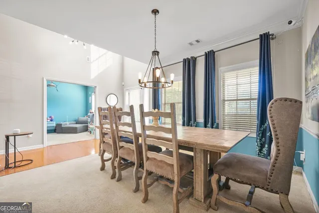 a dining room with furniture and window