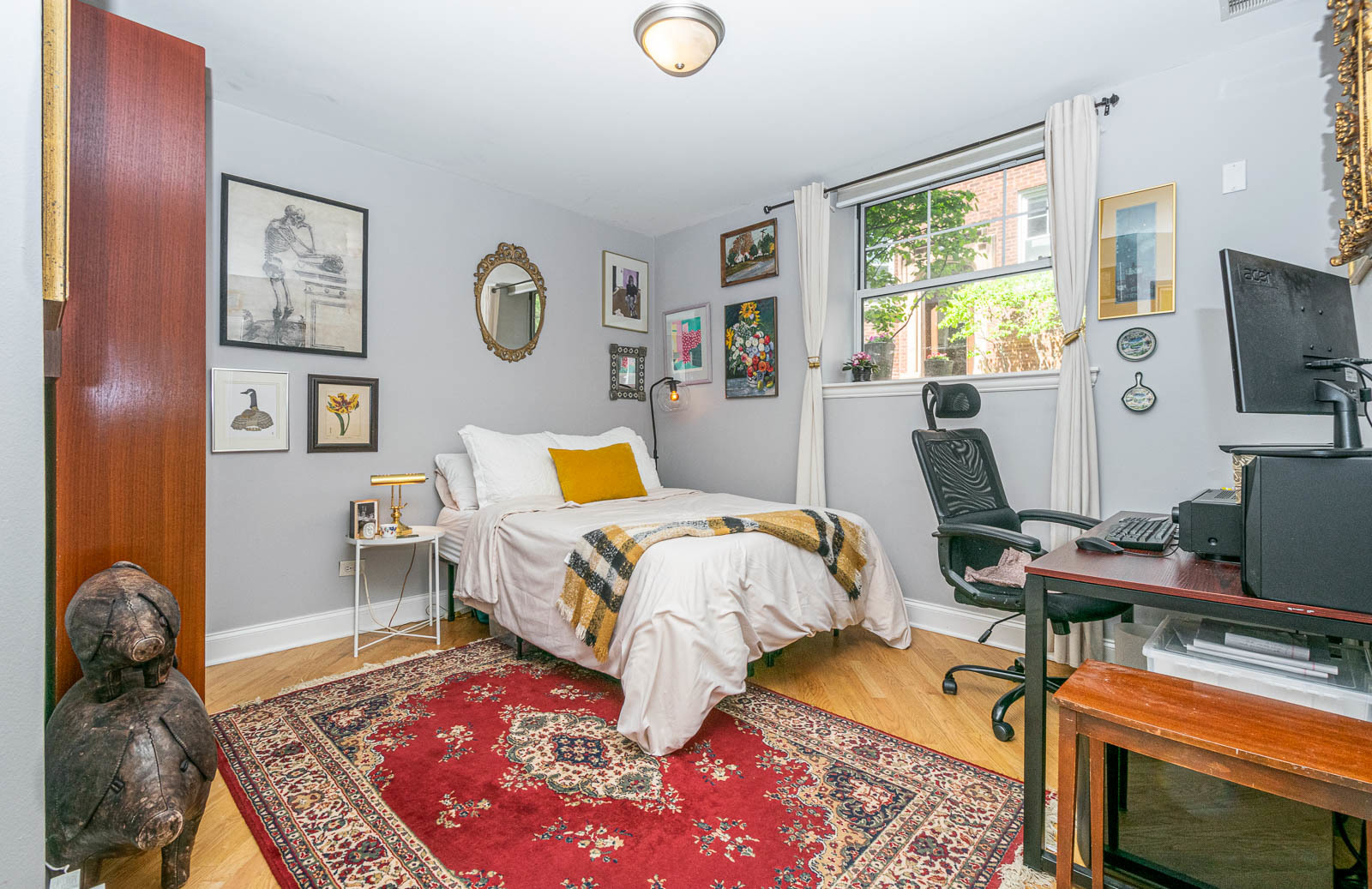 5874 North Ridge Avenue, Unit G Chicago, IL 60660 - Photo 12 of 14 a bed room with a bed and a window