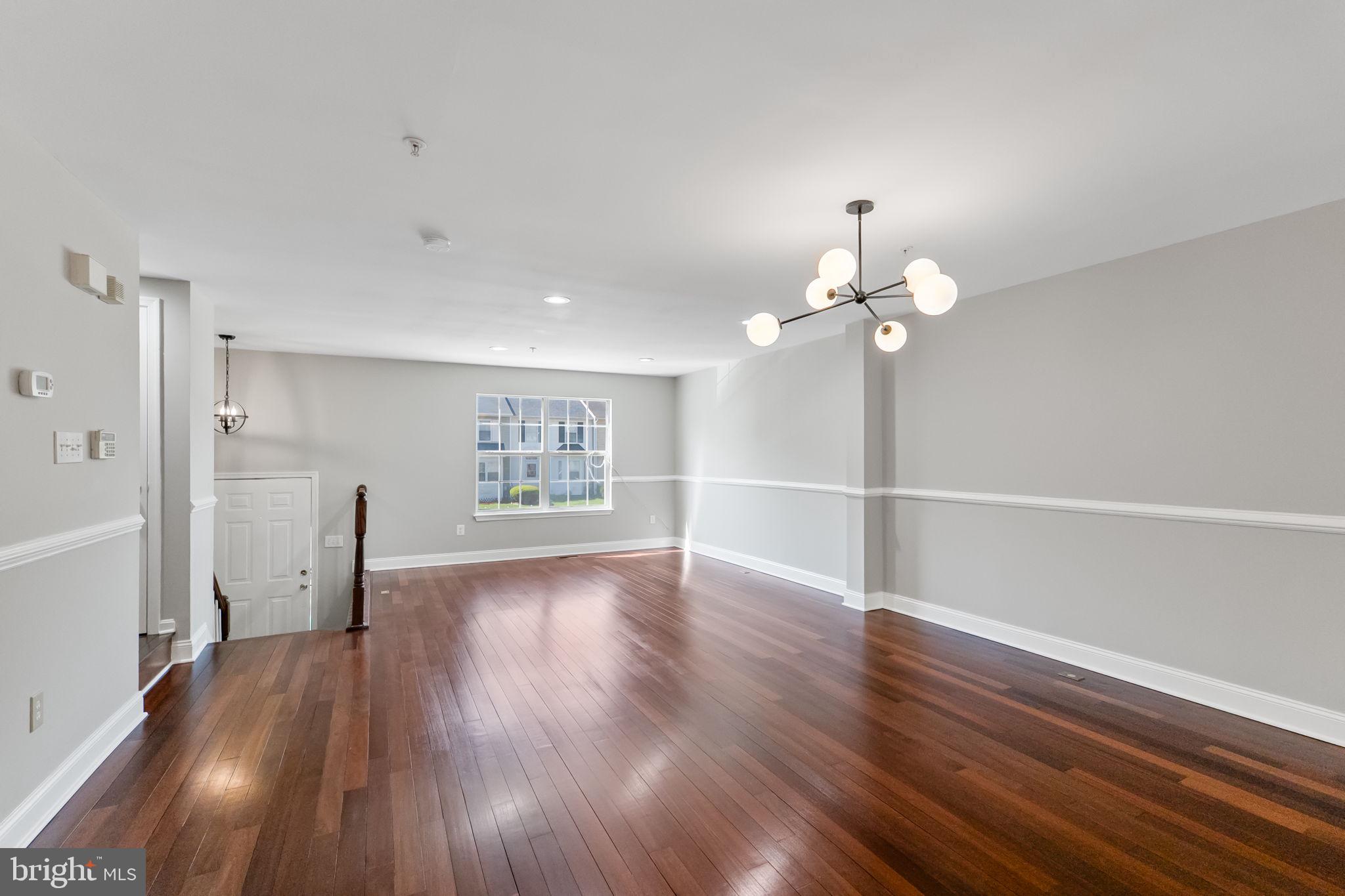 3514 Corn Stream Road Randallstown, MD 21133 - Photo 11 of 44 a view of livingroom with hardwood floor and window