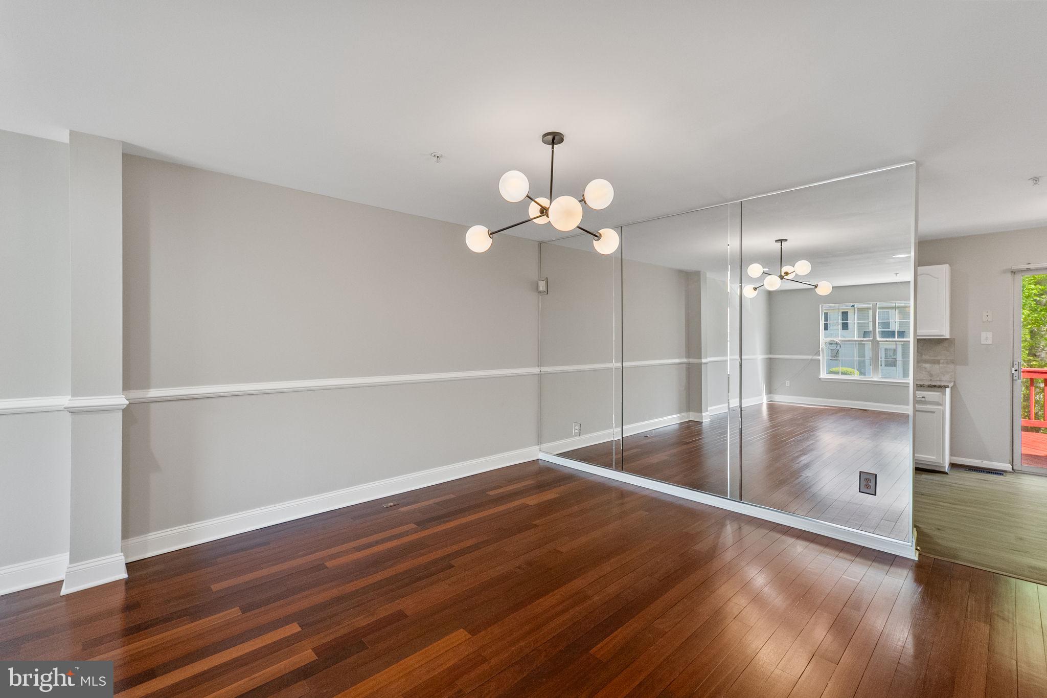 3514 Corn Stream Road Randallstown, MD 21133 - Photo 12 of 44 a view of a room with wooden floor