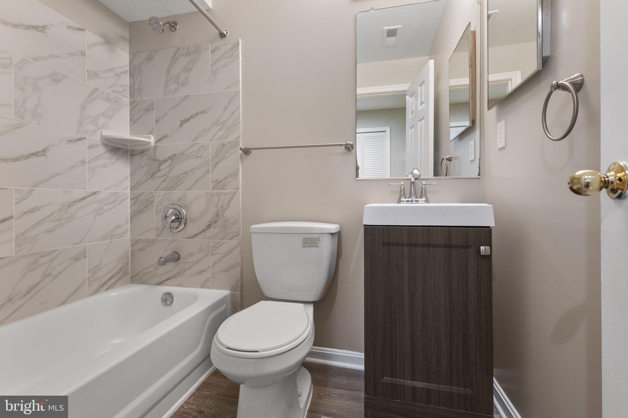 3514 Corn Stream Road Randallstown, MD 21133 - Photo 36 of 44 a bathroom with a toilet sink and bathtub