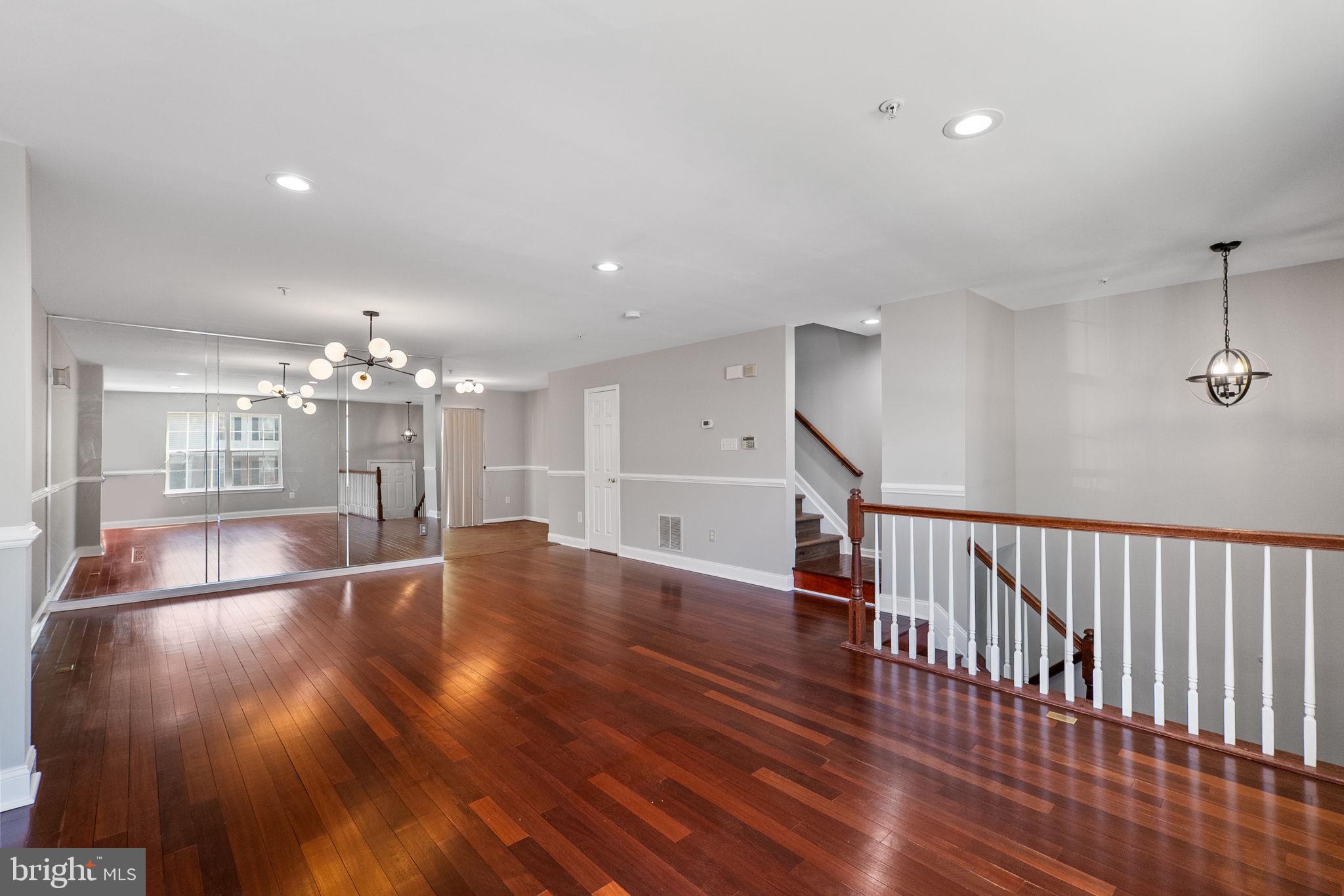 3514 Corn Stream Road Randallstown, MD 21133 - Photo 7 of 44 a view of a livingroom with wooden floor