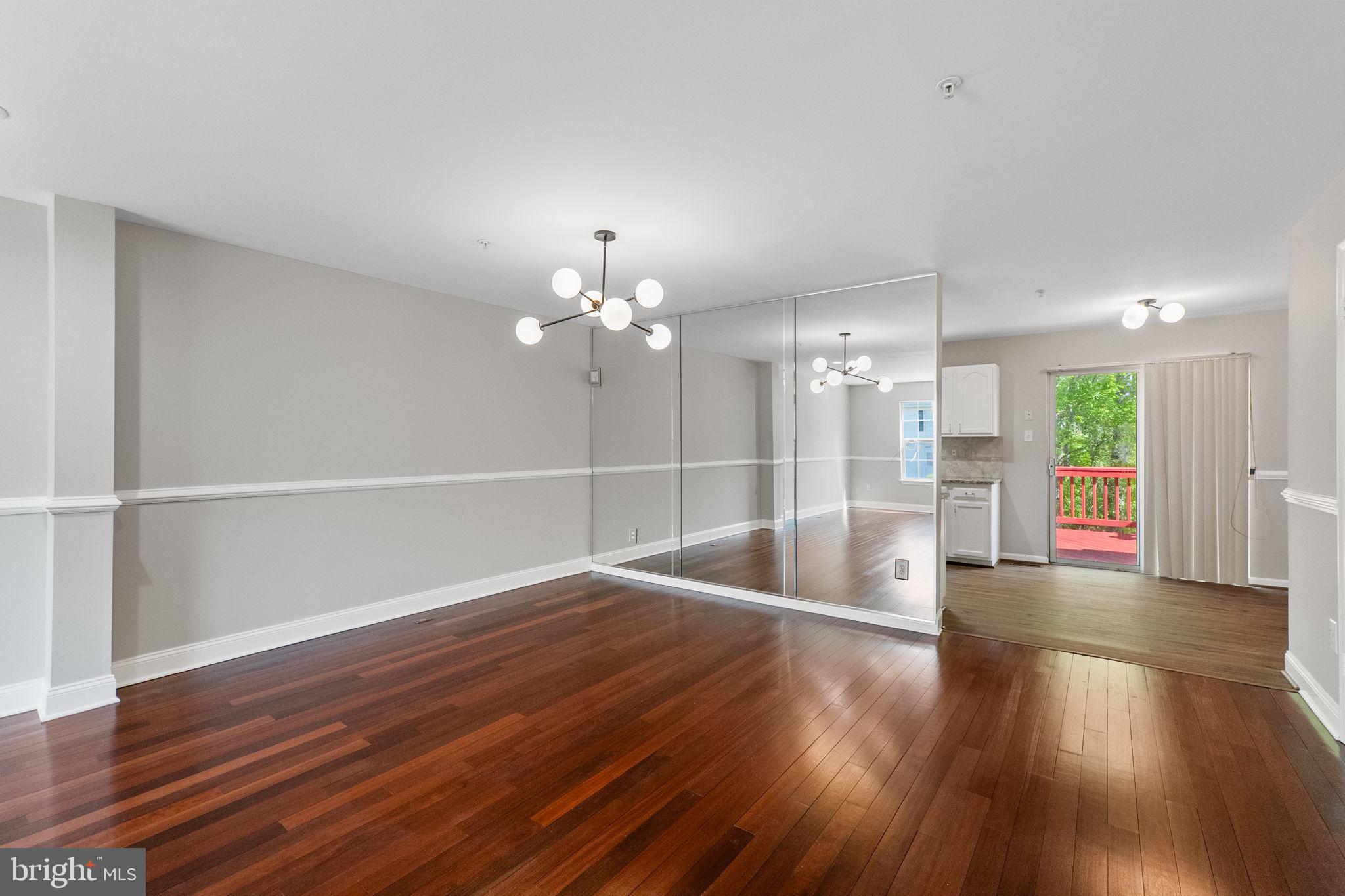 3514 Corn Stream Road Randallstown, MD 21133 - Photo 9 of 44 a view of empty room with wooden floor and fan