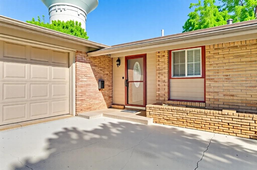 403 East Alexander Lane Euless, TX 76040 - Photo 1 of 1 a view of a house with a wooden fence