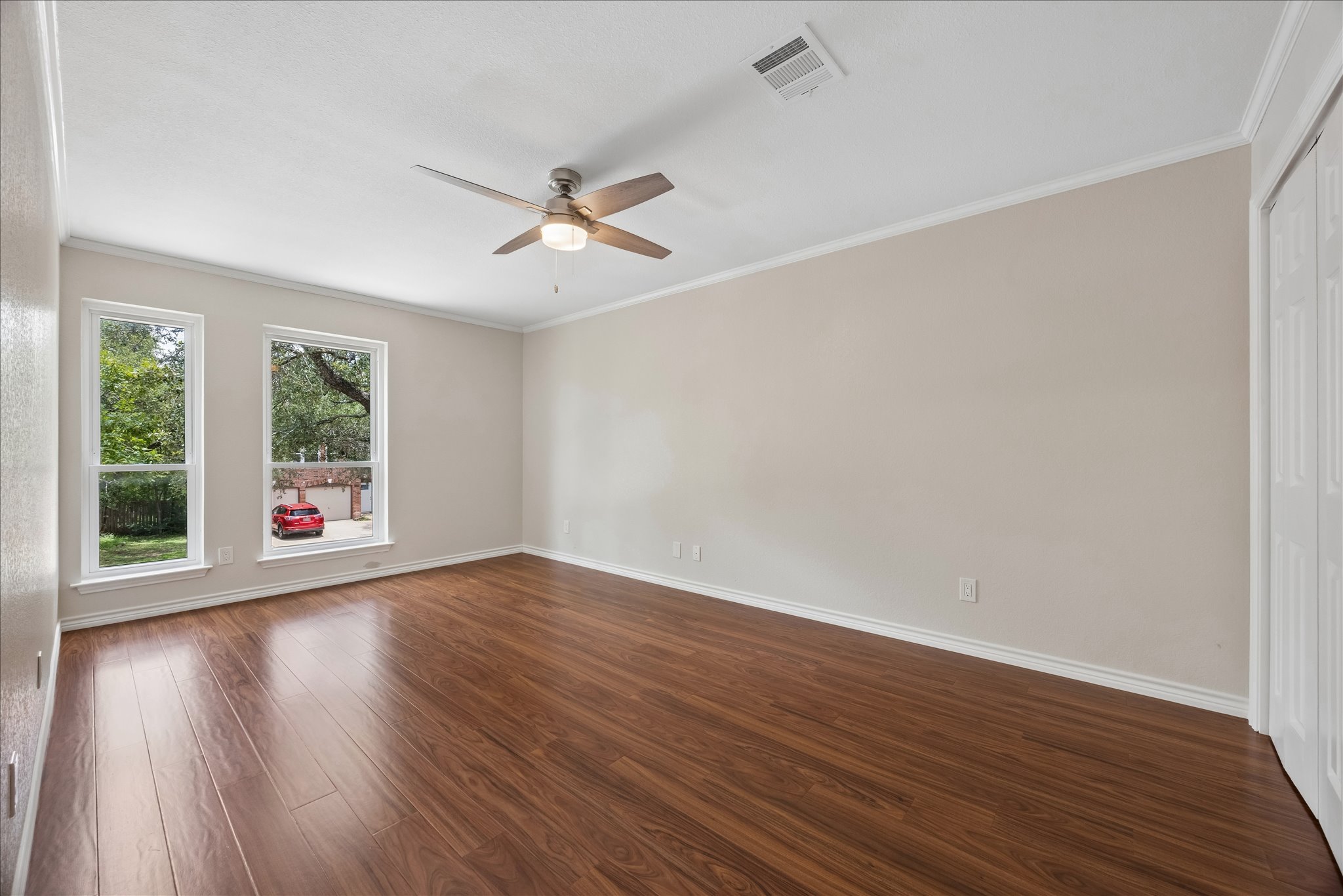 1306 Shady Grove Path Cedar Park, TX 78613 - Photo 29 of 40 a view of empty room with wooden floor and fan