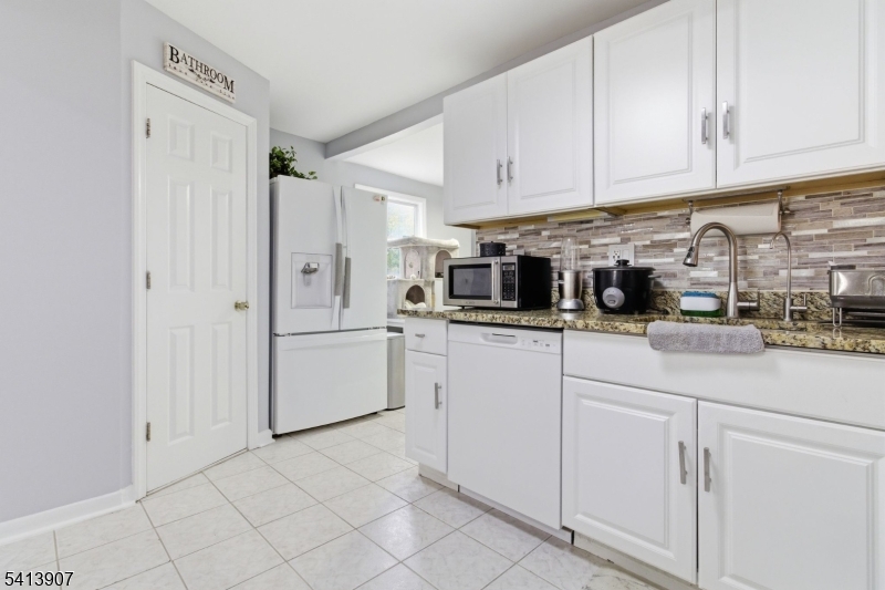 32 Cedar Avenue Elizabeth, NJ 07202 - Photo 8 of 32 a kitchen with white cabinets and white appliances