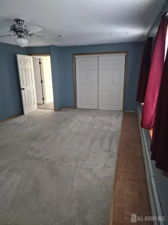 a view of an empty room and a window