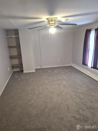 a view of a house with a yard and a garden