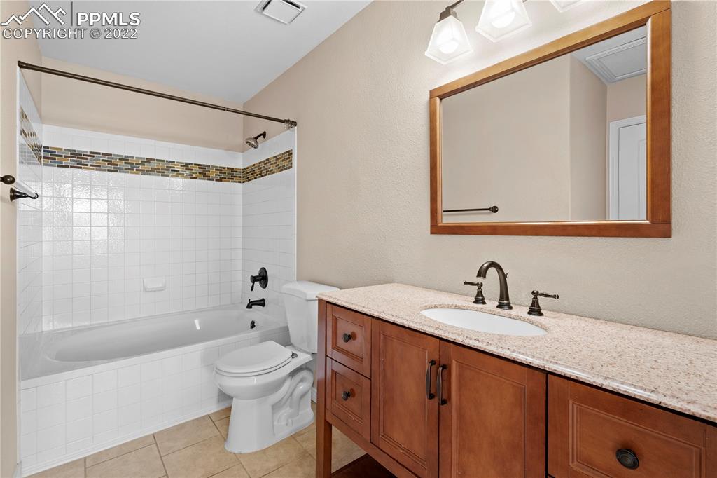 6910 Los Reyes Circle Colorado Springs, CO 80918 - Photo 12 of 38 a bathroom with a sink a toilet and shower