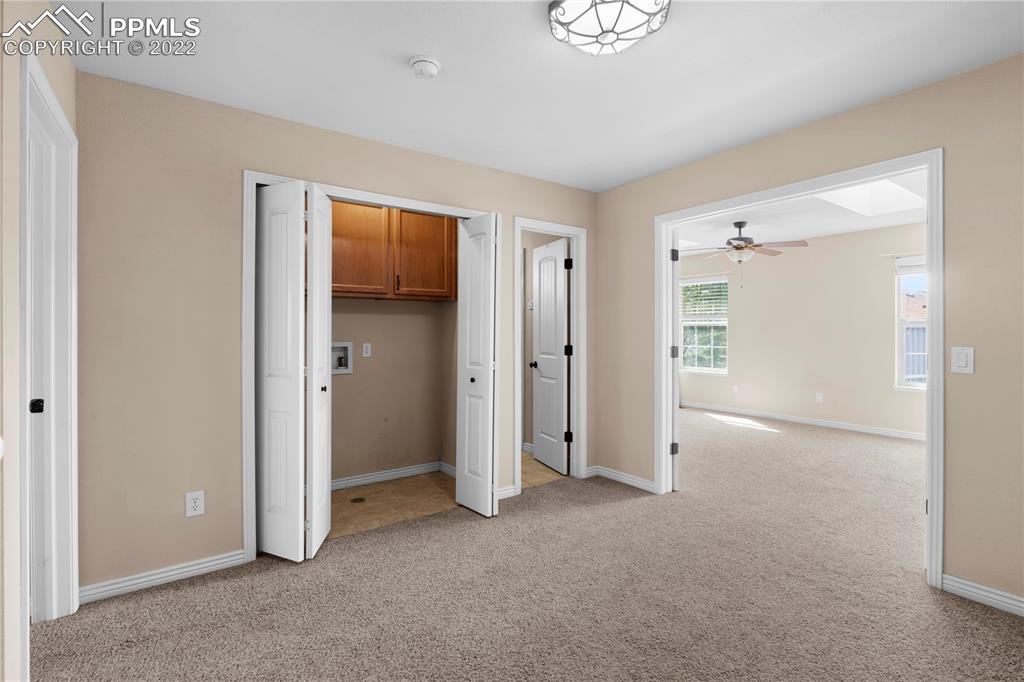 6910 Los Reyes Circle Colorado Springs, CO 80918 - Photo 16 of 38 an empty room with closet and a window