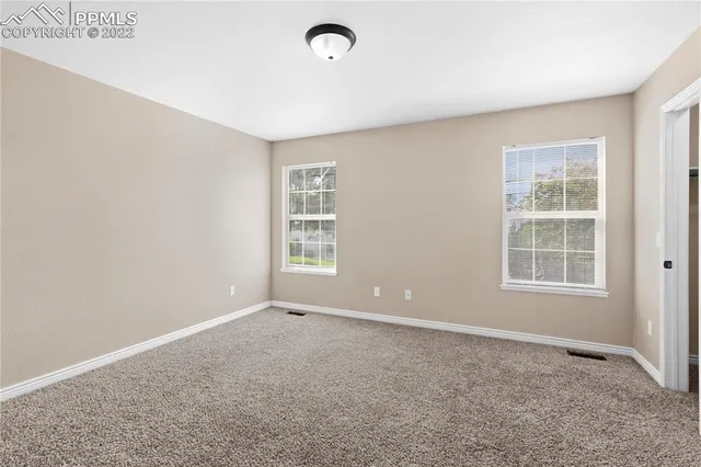 an empty room with windows