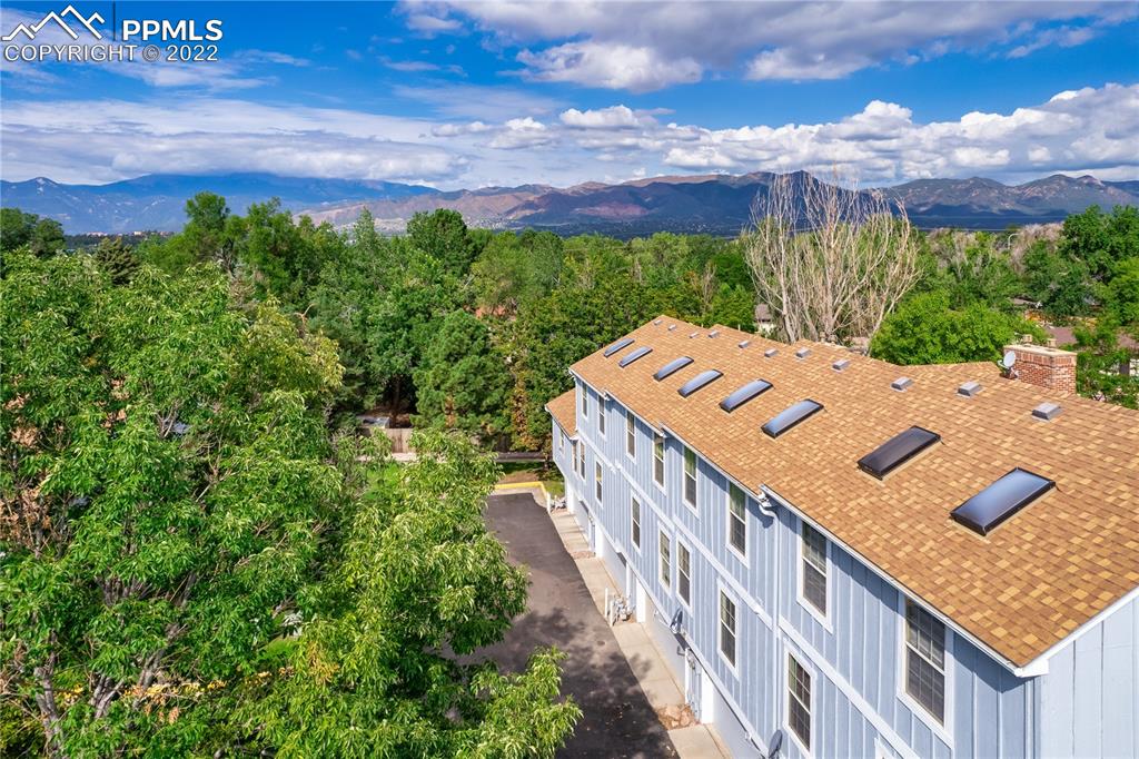 6910 Los Reyes Circle Colorado Springs, CO 80918 - Photo 34 of 38 a view of a house with a yard