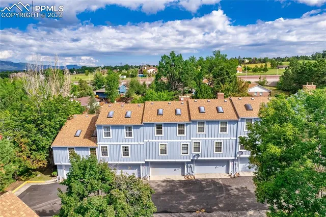 an aerial view of a house with a garden