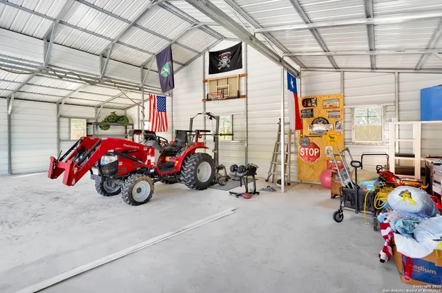 a view of a garage with a bike and a roof