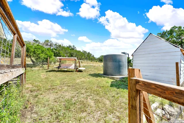 a backyard of a house with lots of green space