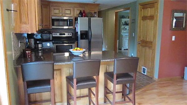 65 Carruth Road Templeton, MA 01468 - Photo 11 of 19 a kitchen with a dining table and chairs