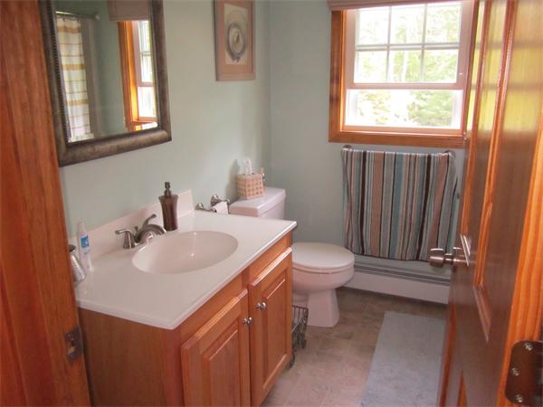 65 Carruth Road Templeton, MA 01468 - Photo 18 of 19 a bathroom with a toilet sink and mirror