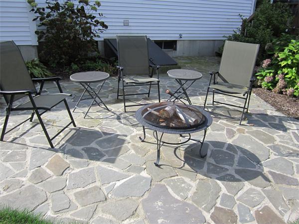 65 Carruth Road Templeton, MA 01468 - Photo 9 of 19 a view of backyard with table and chairs and a potted plant