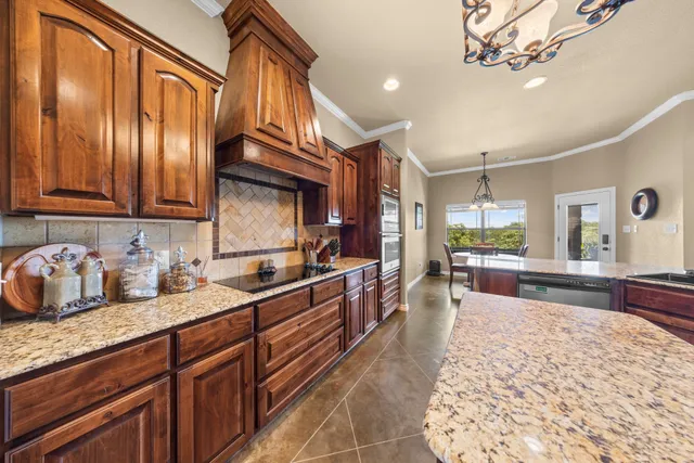 a kitchen with granite countertop lots of counter top space
