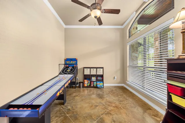 a room with a bed and a chandelier