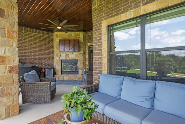 a living room filled with furniture and a fireplace
