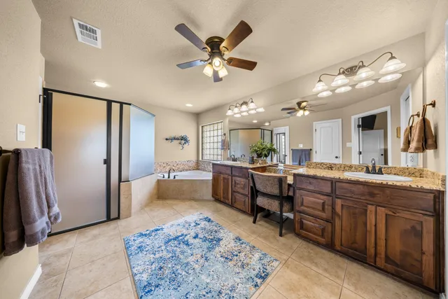 a large kitchen with a table and chairs