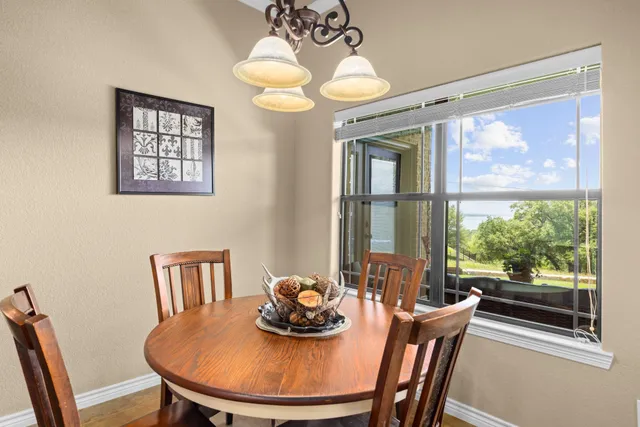 a view of a dining room with furniture window and outside view