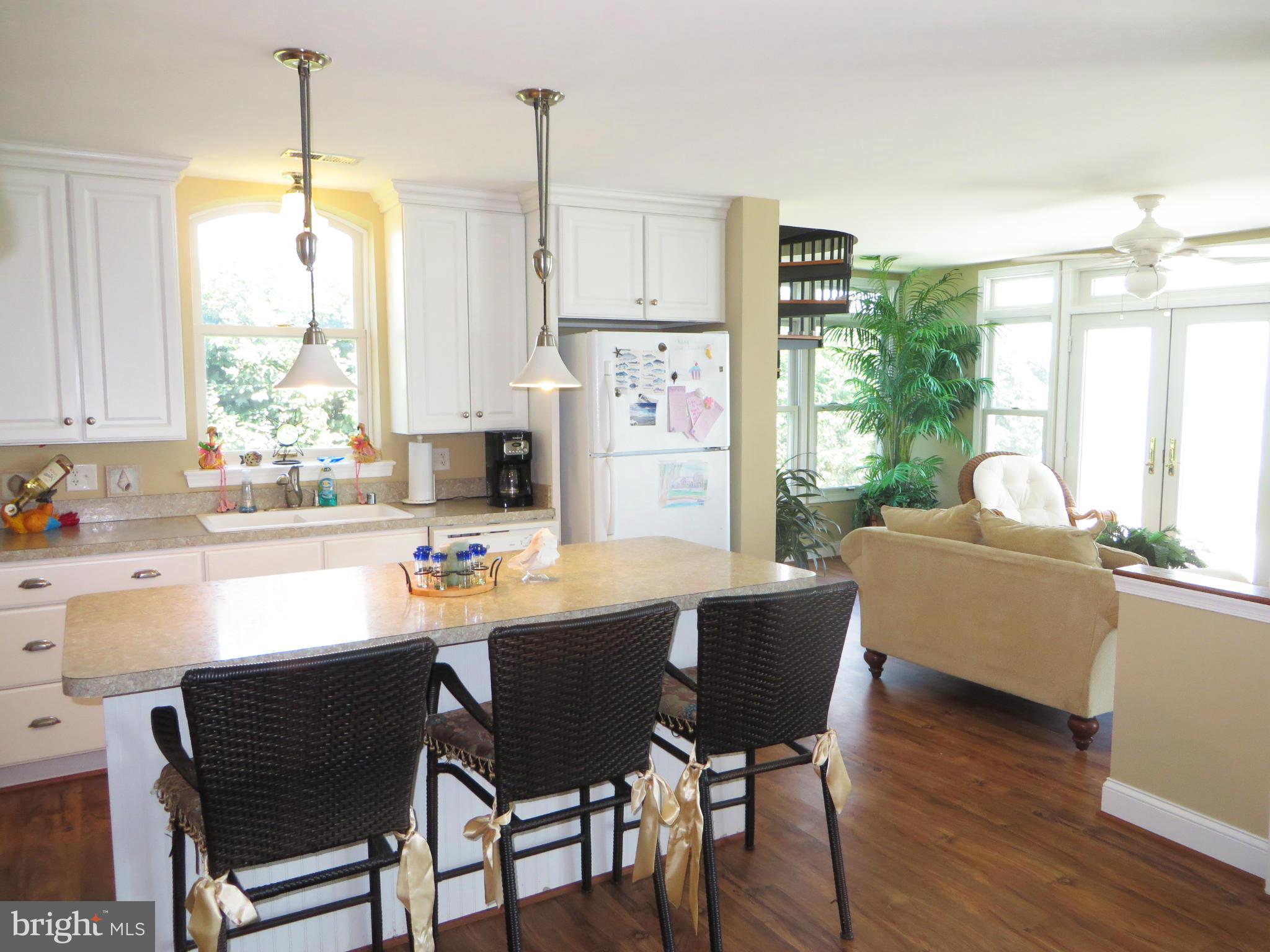 16144 Murray Road Ridge, MD 20680 - Photo 14 of 30 a dining room with furniture window wooden floor