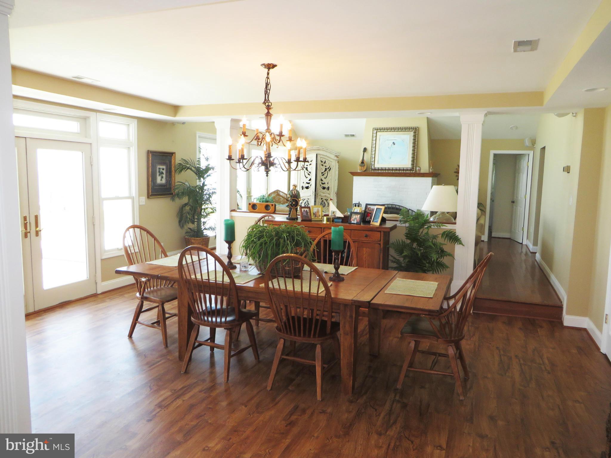 16144 Murray Road Ridge, MD 20680 - Photo 15 of 30 a view of a dining room with furniture window and wooden floor