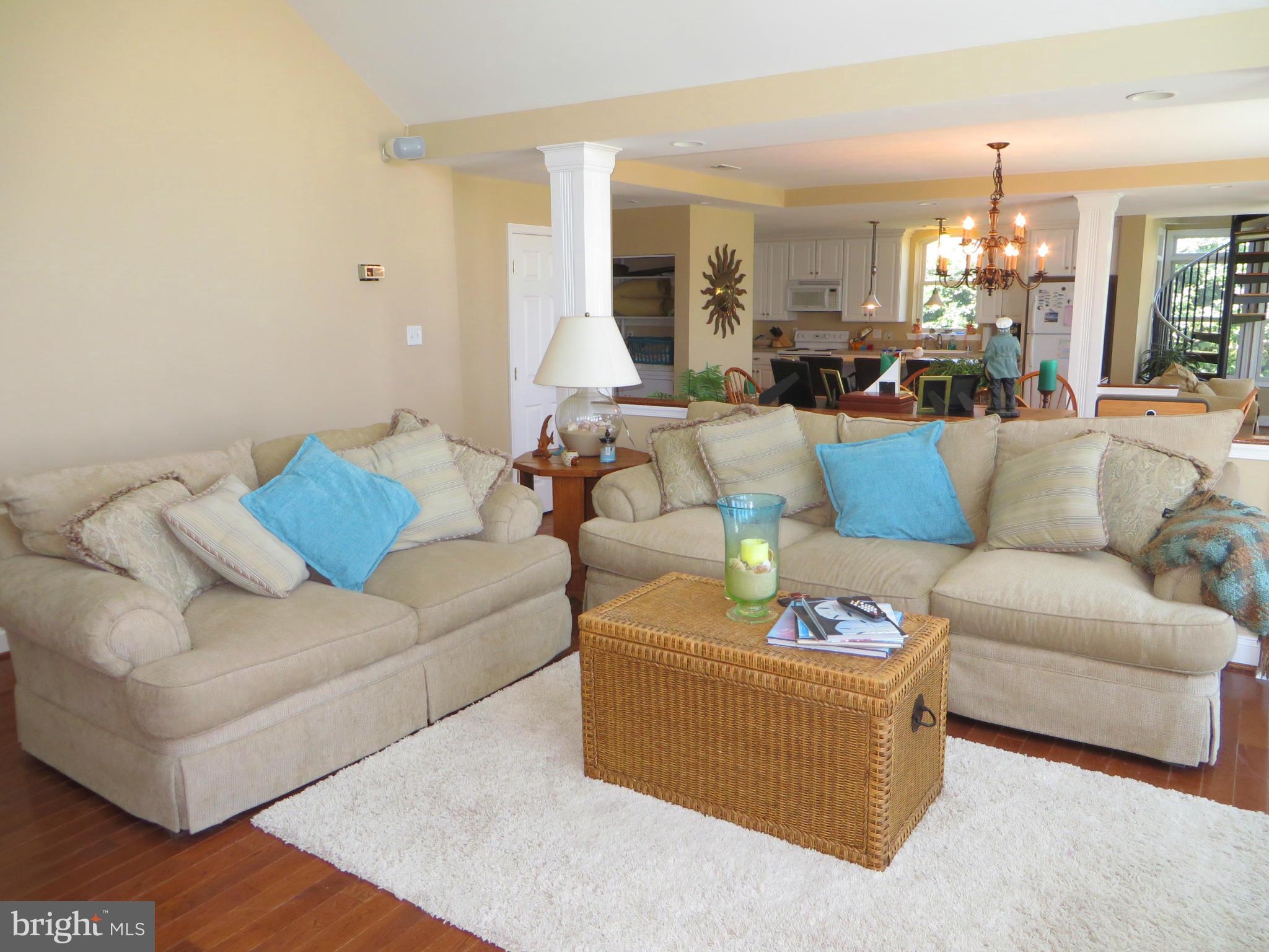 16144 Murray Road Ridge, MD 20680 - Photo 17 of 30 a living room with furniture and a chandelier