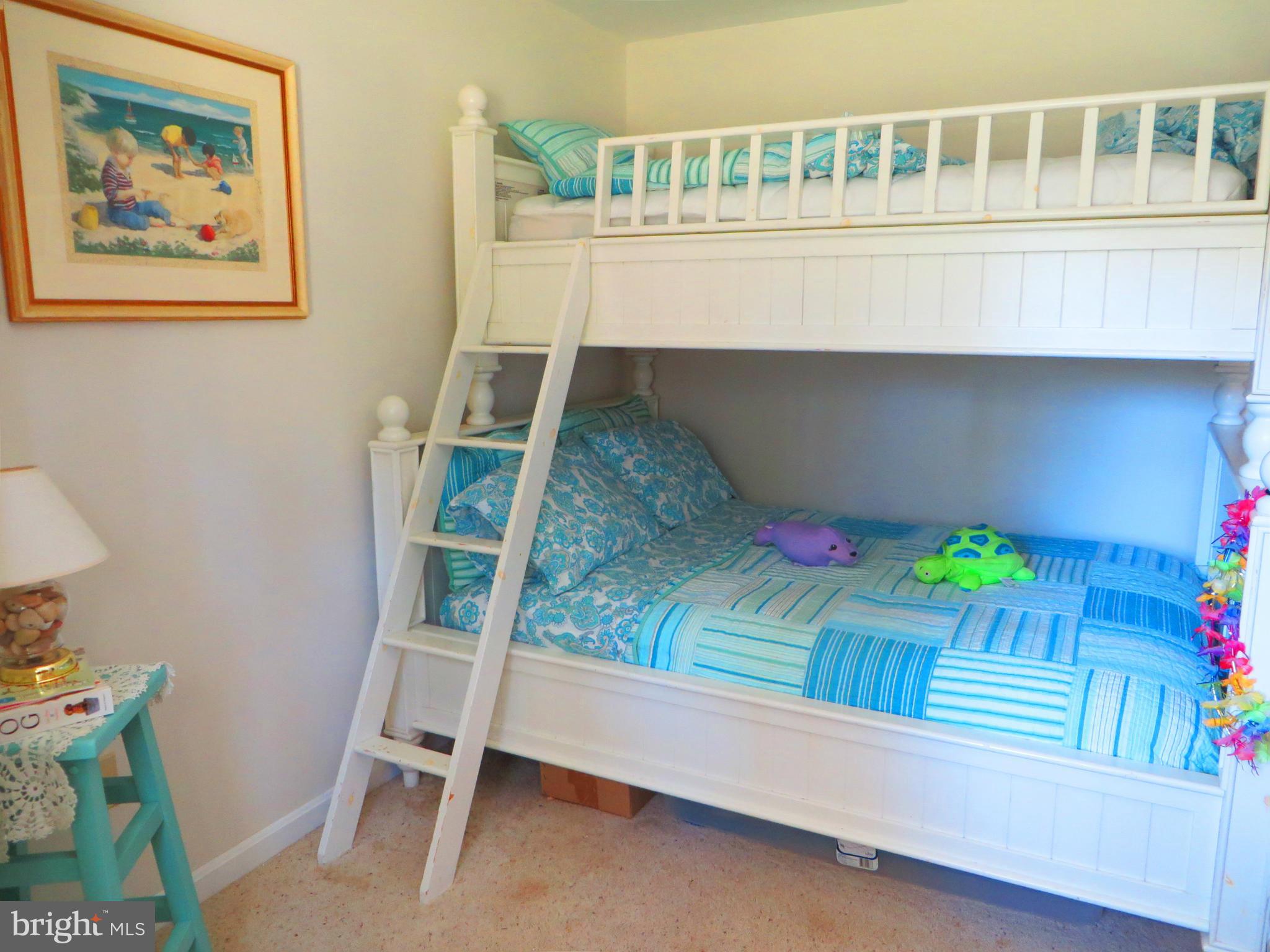 16144 Murray Road Ridge, MD 20680 - Photo 22 of 30 a room with a bench and a book shelf
