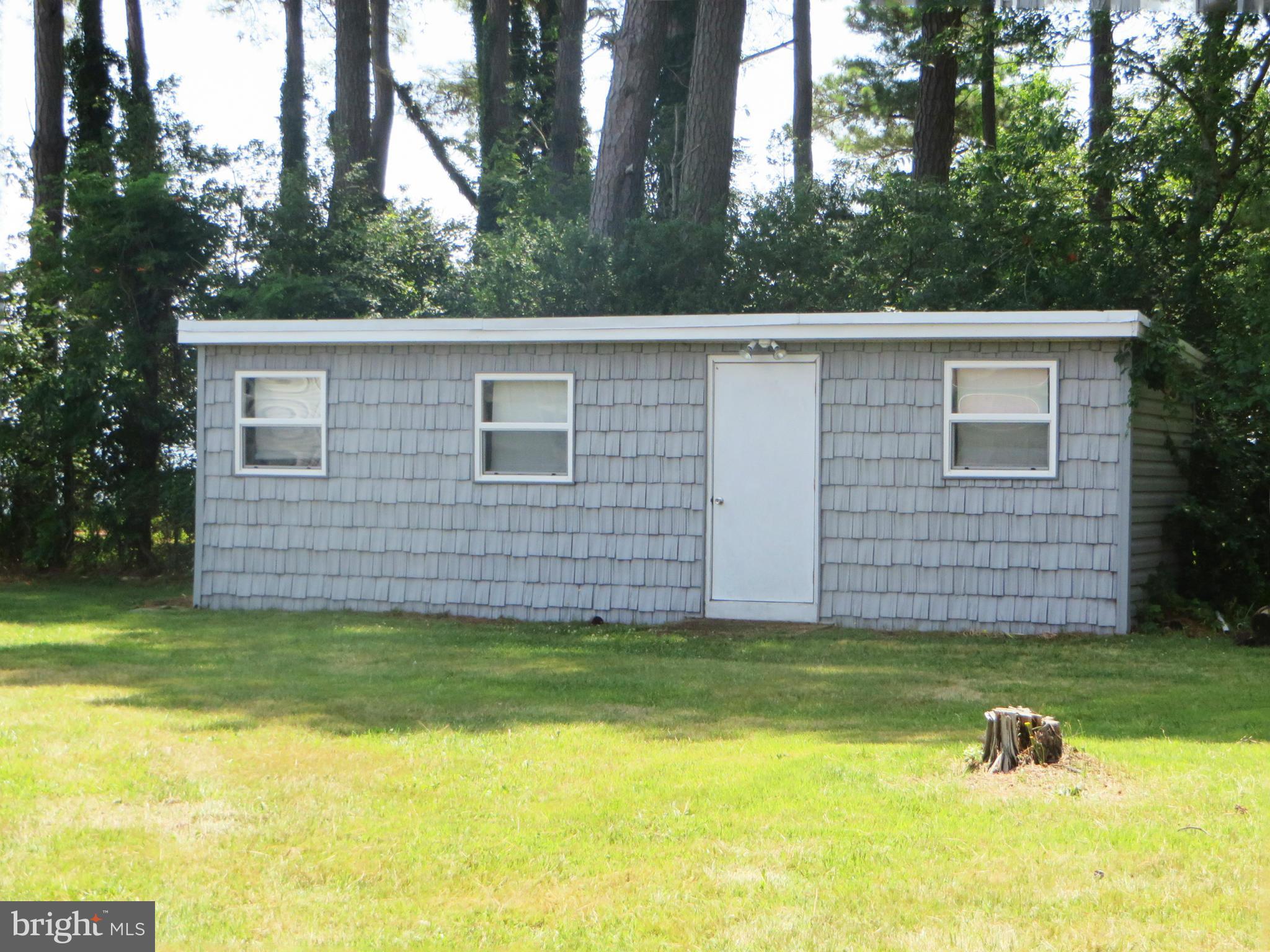 16144 Murray Road Ridge, MD 20680 - Photo 29 of 30 a view of a backyard with a garden