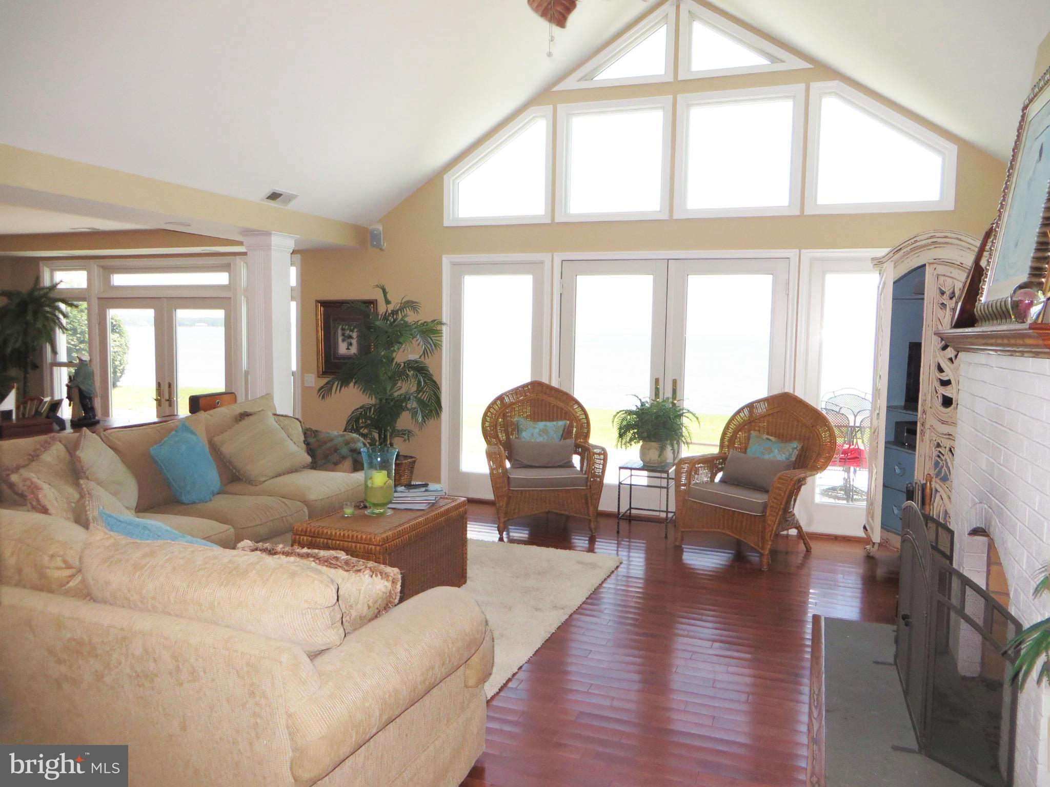 16144 Murray Road Ridge, MD 20680 - Photo 4 of 30 a living room with furniture fireplace and a large window
