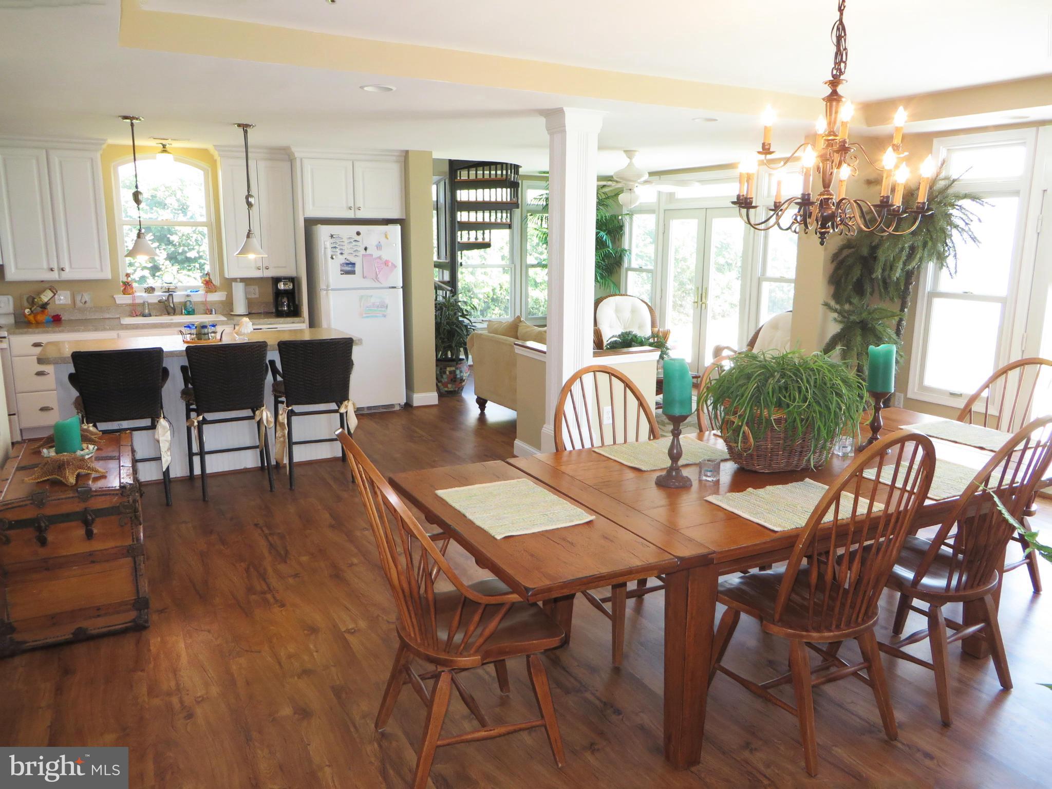 16144 Murray Road Ridge, MD 20680 - Photo 6 of 30 a view of a dining room with furniture and wooden floor