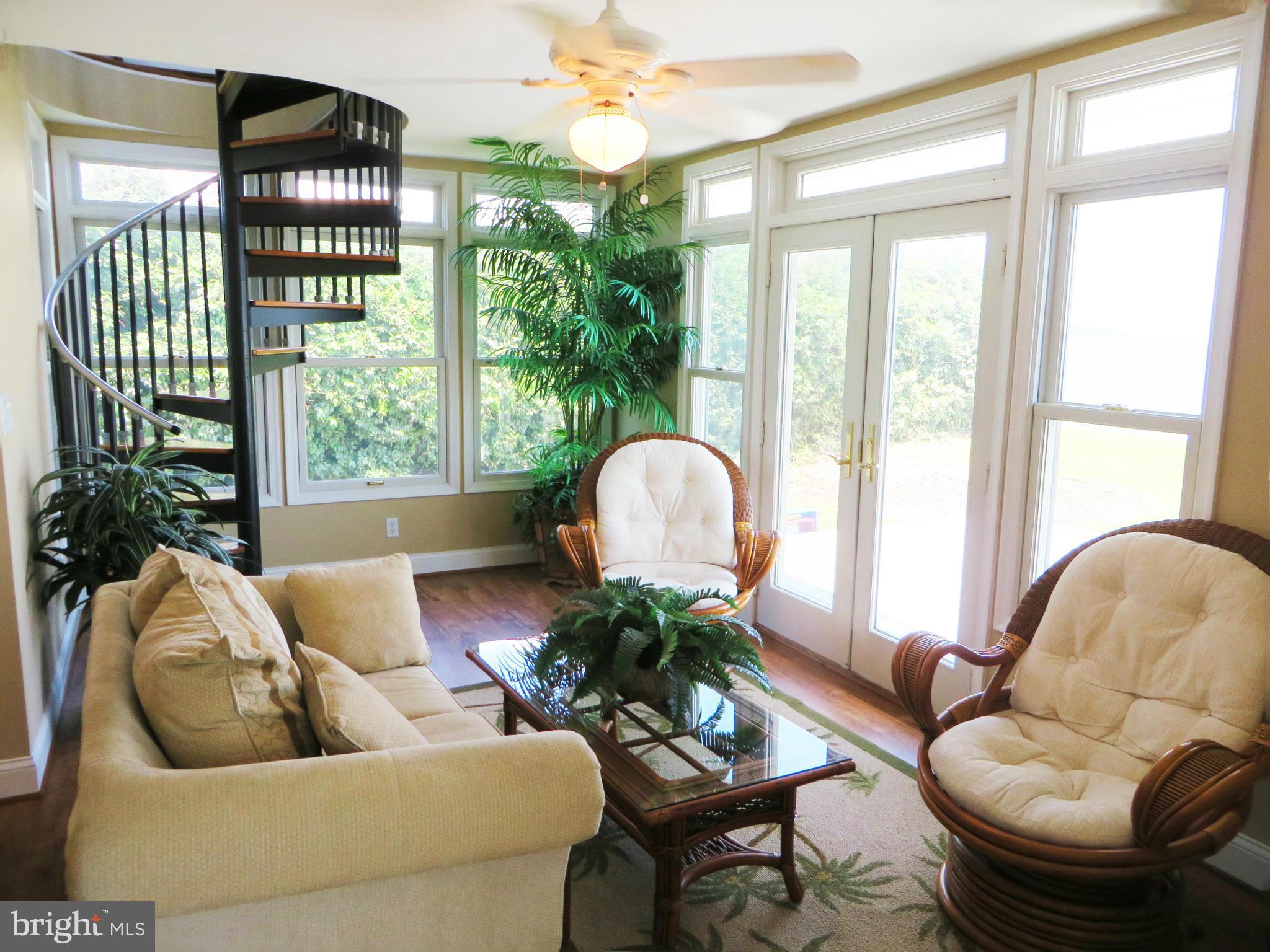 16144 Murray Road Ridge, MD 20680 - Photo 8 of 30 a living room with furniture and a large window