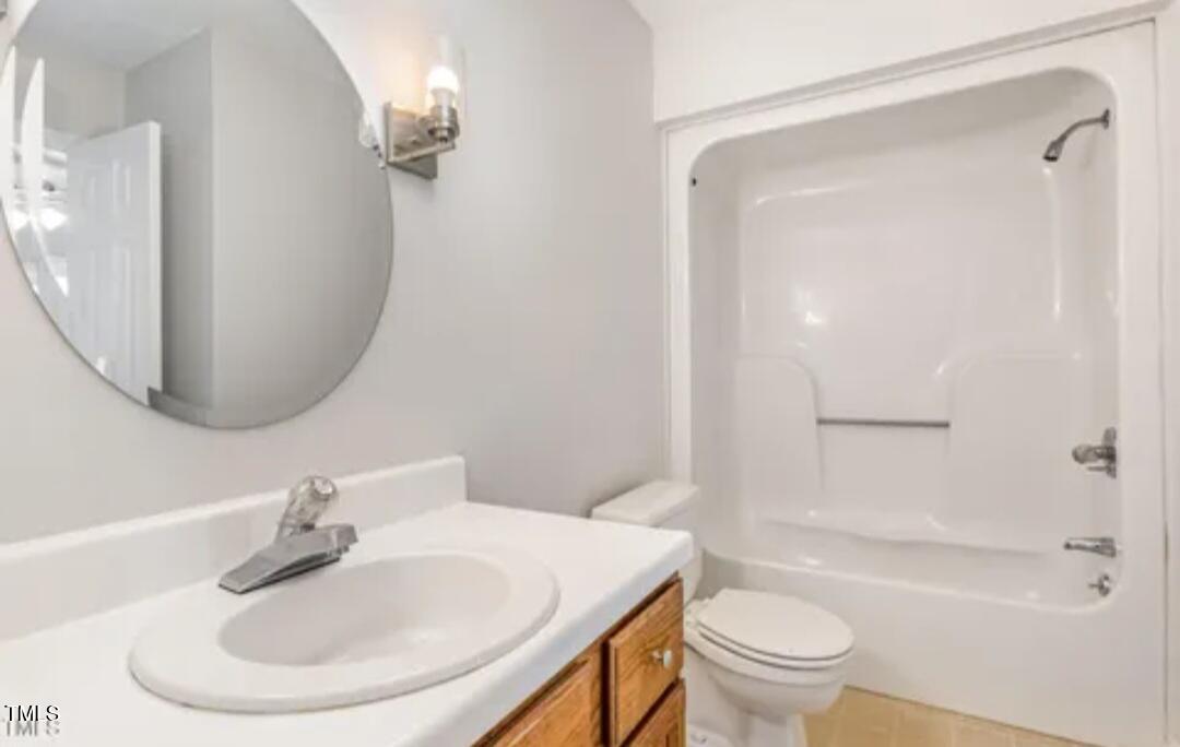 71 Stone Hill Court Durham, NC 27704 - Photo 11 of 13 a bathroom with a sink toilet and a mirror
