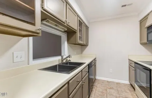a kitchen with stainless steel appliances granite countertop a sink and a microwave