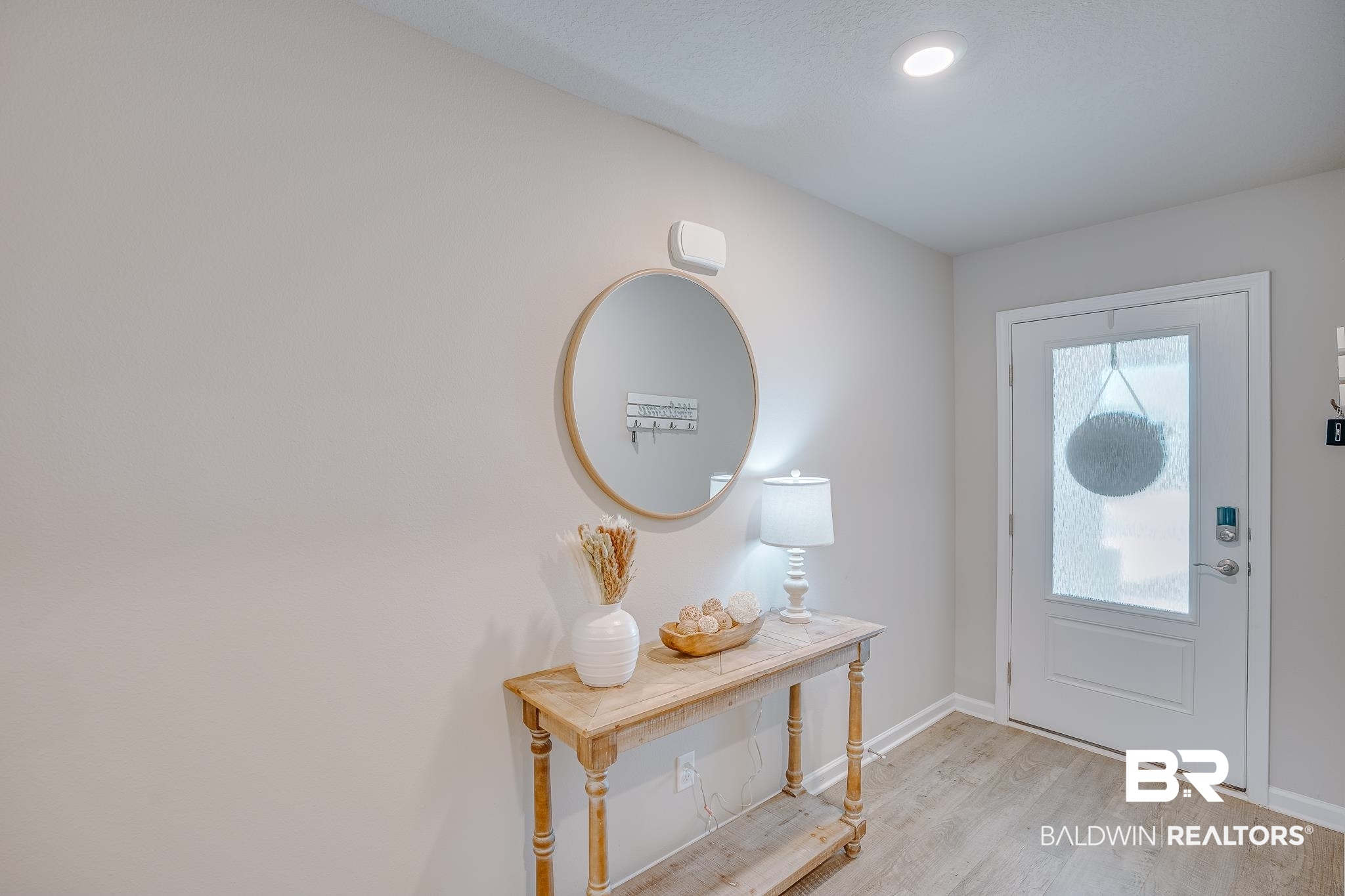 8242 Sycamore Way Semmes, AL 36575 - Photo 28 of 43 Foyer entrance featuring light wood finished floors and baseboards