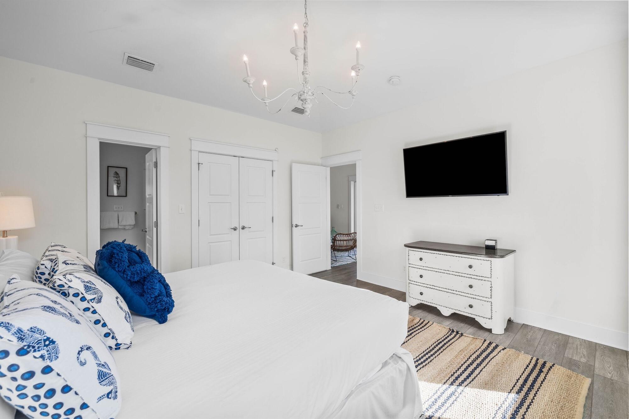 170 Seacrest Beach Boulevard East Inlet Beach, FL 32461 - Photo 16 of 38 a bedroom with a bed and a flat screen tv