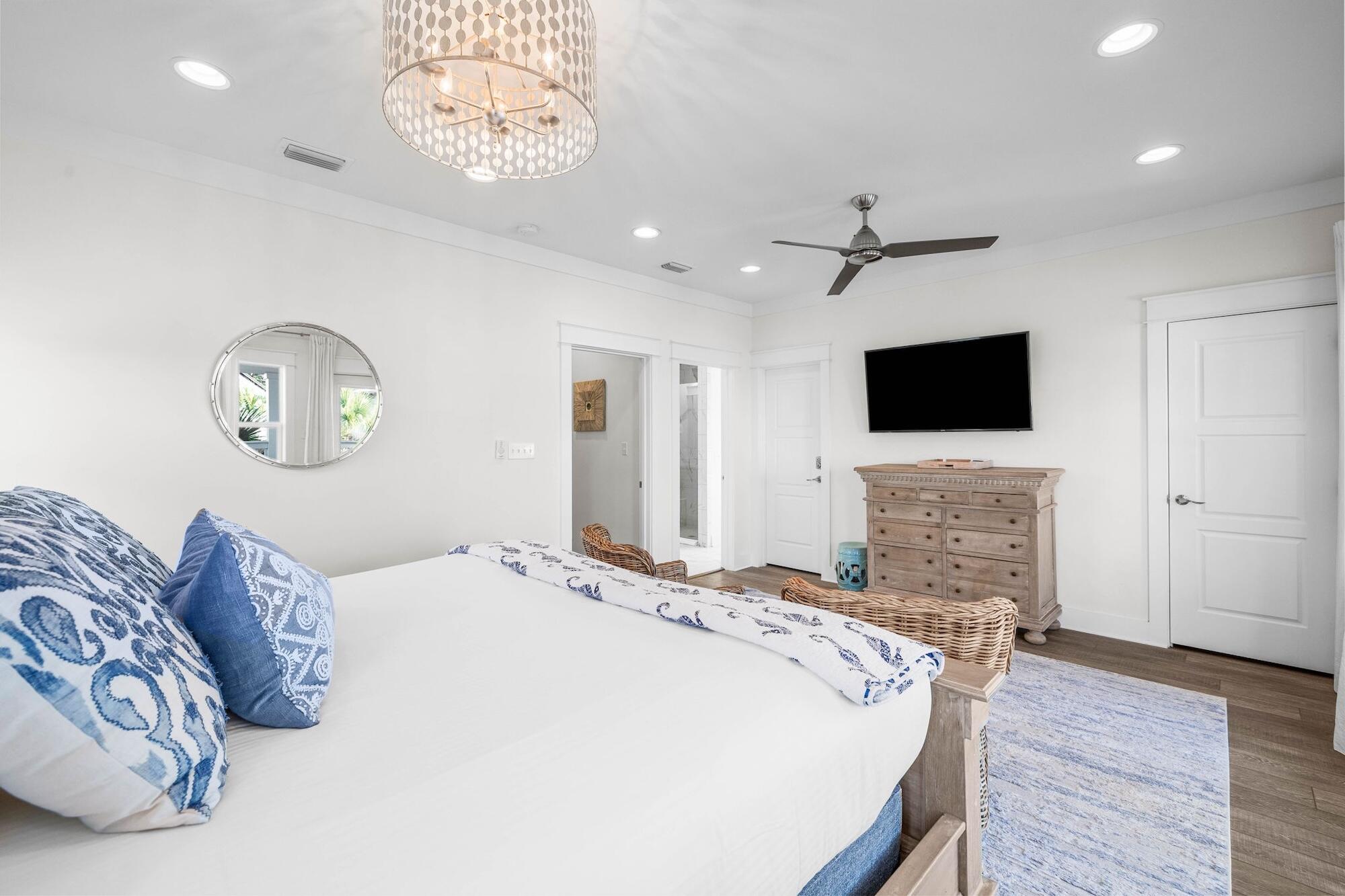 170 Seacrest Beach Boulevard East Inlet Beach, FL 32461 - Photo 17 of 38 a spacious bedroom with a bed and a flat screen tv