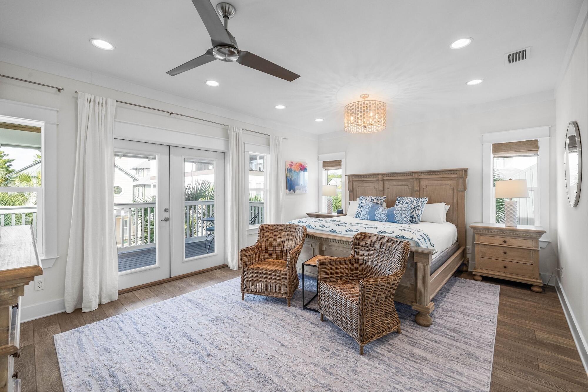 170 Seacrest Beach Boulevard East Inlet Beach, FL 32461 - Photo 20 of 38 a bedroom with a large bed and wooden floor