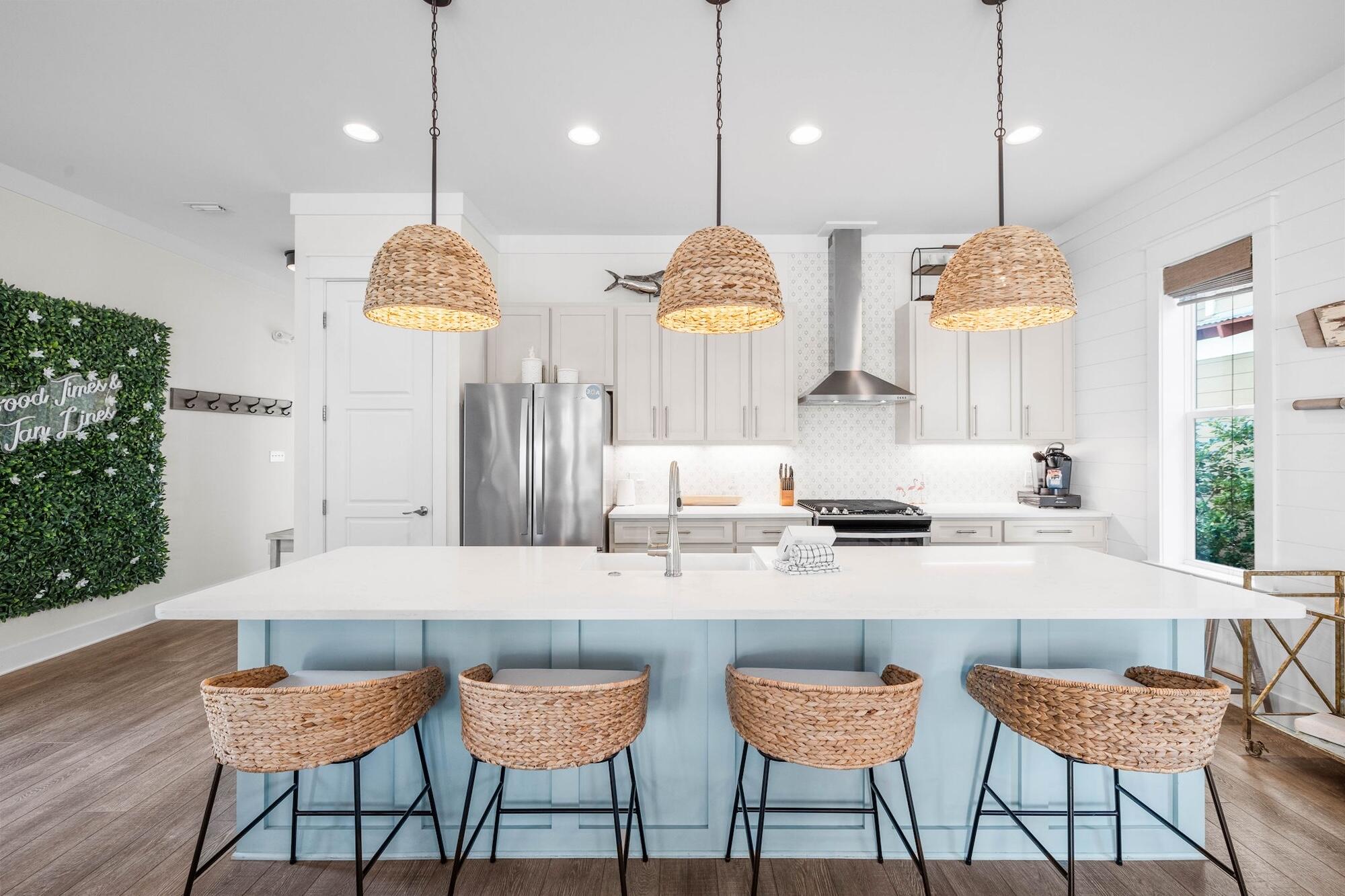 170 Seacrest Beach Boulevard East Inlet Beach, FL 32461 - Photo 2 of 38 a kitchen with stainless steel appliances kitchen island a chandelier and a refrigerator