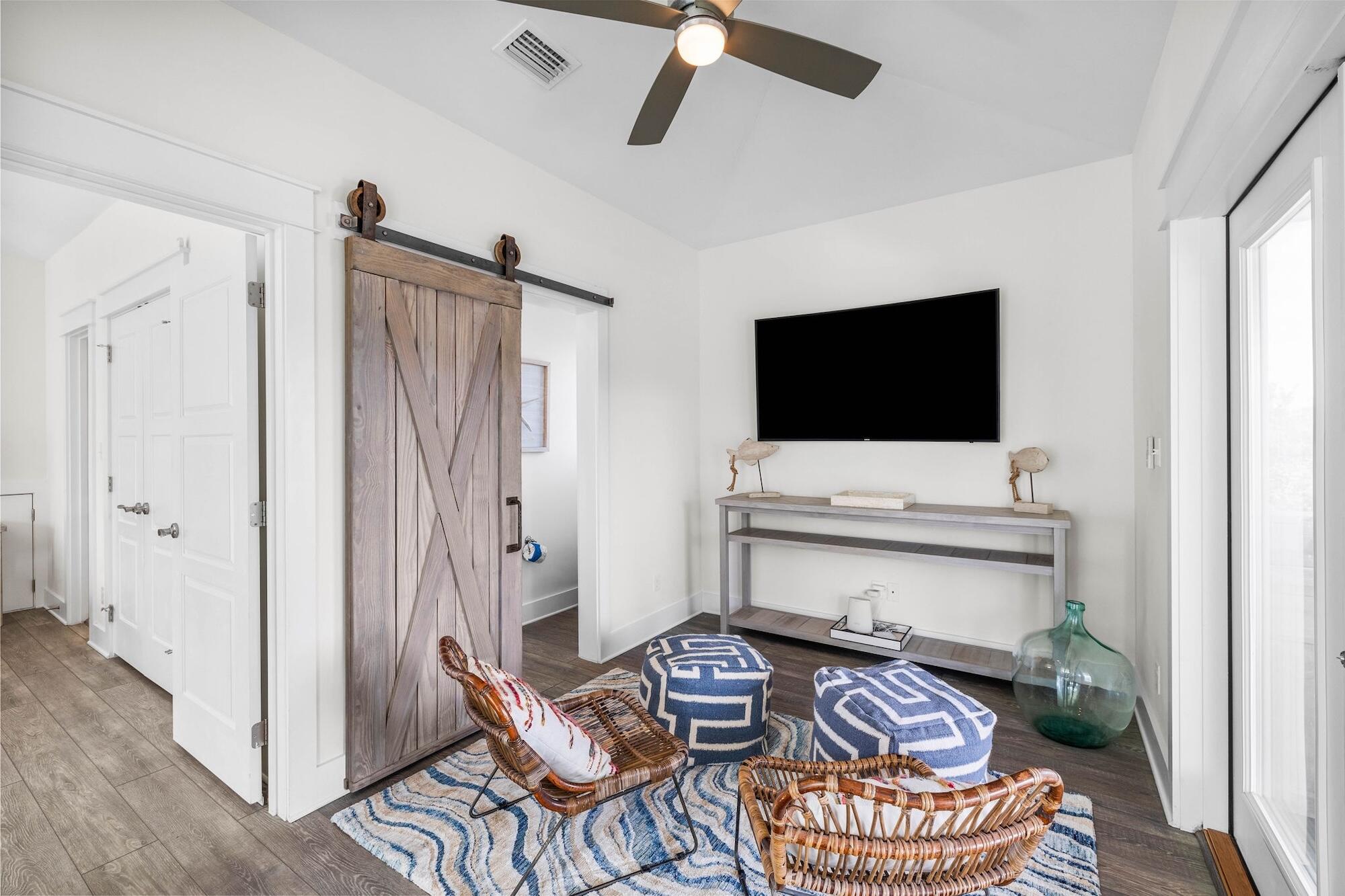 170 Seacrest Beach Boulevard East Inlet Beach, FL 32461 - Photo 23 of 38 a living room with furniture and a flat screen tv