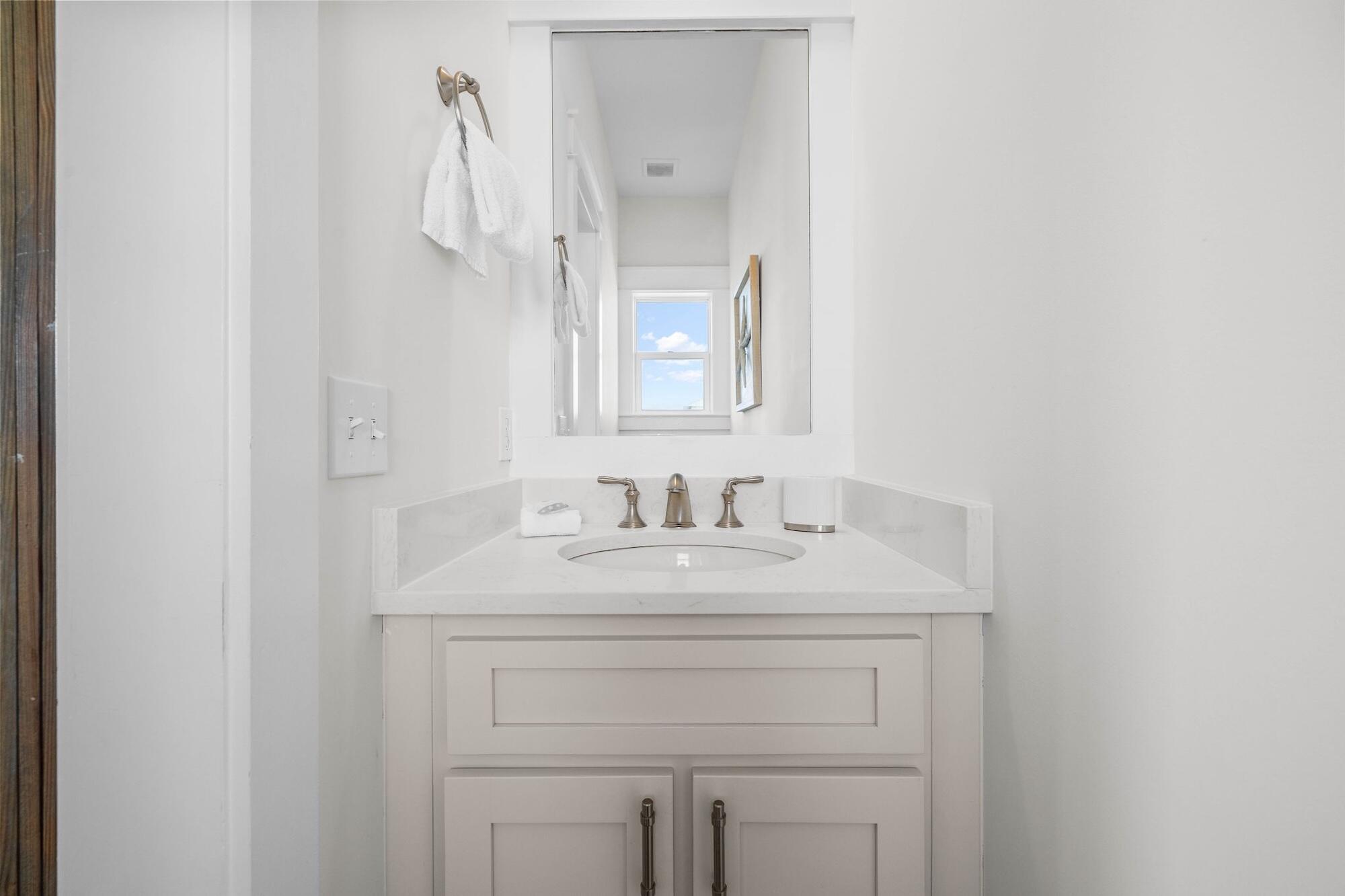 170 Seacrest Beach Boulevard East Inlet Beach, FL 32461 - Photo 25 of 38 a bathroom with a sink vanity and a mirror