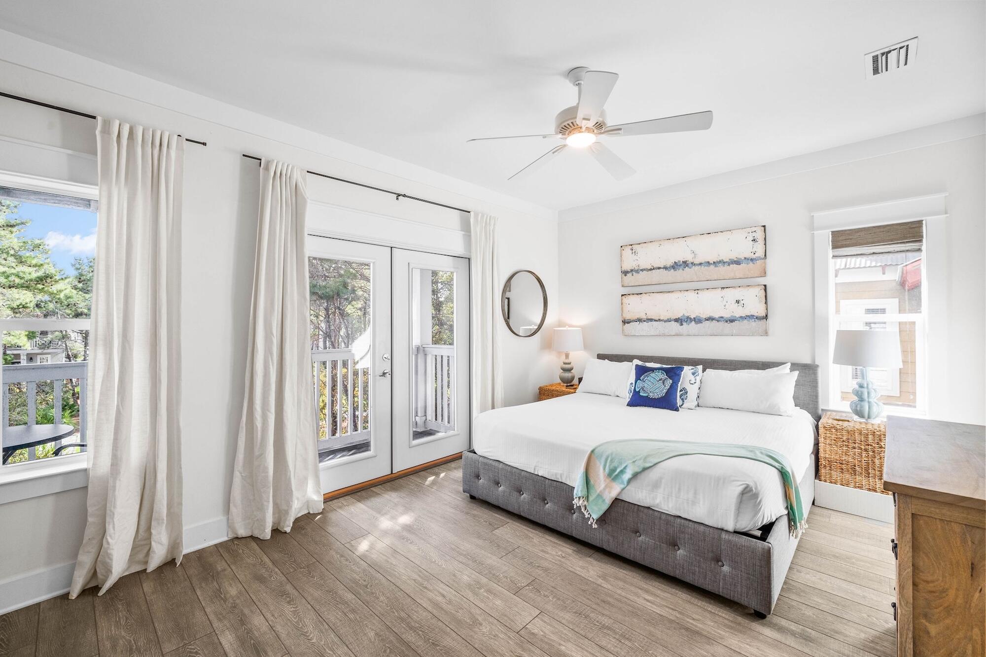170 Seacrest Beach Boulevard East Inlet Beach, FL 32461 - Photo 29 of 38 a bedroom with a large bed and a chandelier